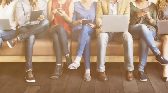 group sitting on bench