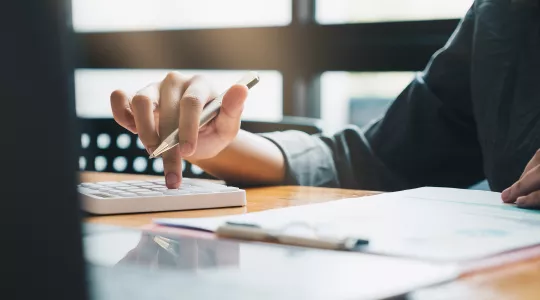 Close up image of a person working on paperwork