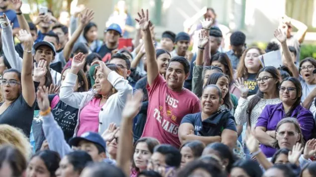 group of people with hands up